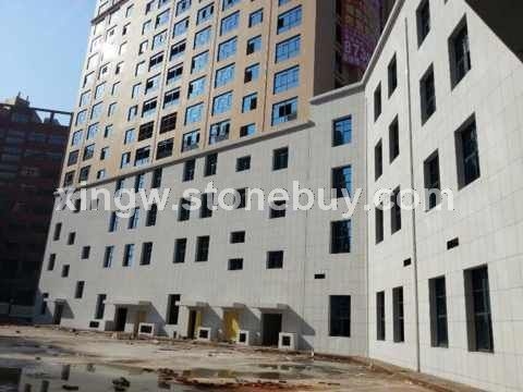 金点芝麻白-石家庄国际机场外墙干挂工地